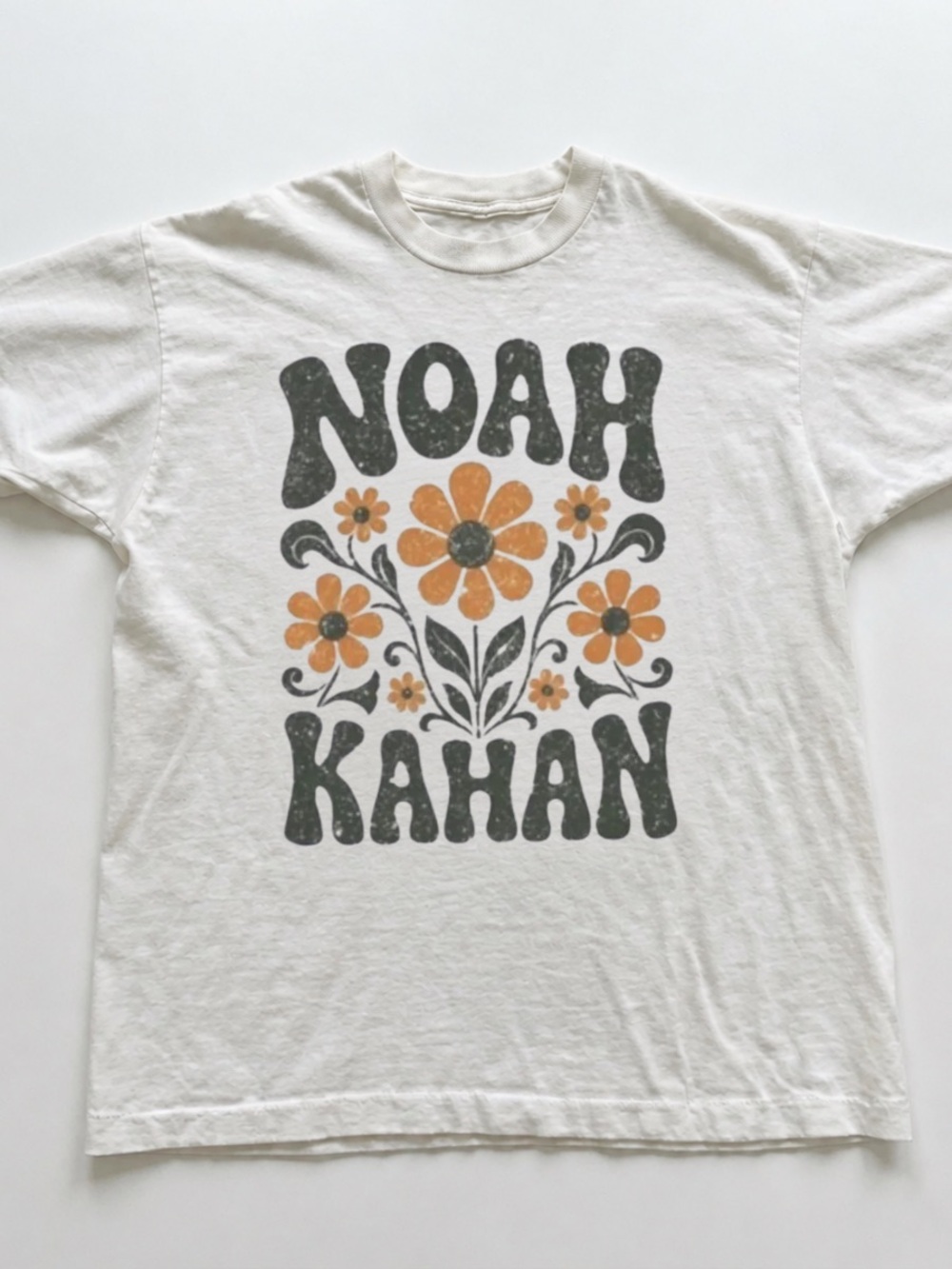 White Tee with Orange Floral Graphic and Black Text